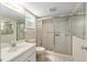 Bathroom features shower with glass door, white vanity with light fixtures and mirror at 9855 Sw 85Th Terrace Rd # A, Ocala, FL 34481