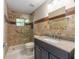 Bathroom with shower, granite countertops, tile walls and flooring at 9855 Sw 85Th Terrace Rd # A, Ocala, FL 34481