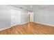Spacious bedroom with wood laminate flooring, ceiling fan, and closet at 9855 Sw 85Th Terrace Rd # A, Ocala, FL 34481