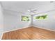 Light and bright bedroom featuring two windows and hardwood floors at 9855 Sw 85Th Terrace Rd # A, Ocala, FL 34481