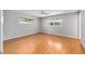 Bright bedroom with wood floors and two windows at 9855 Sw 85Th Terrace Rd # A, Ocala, FL 34481