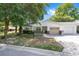 Charming single-story home featuring a well-kept lawn and attached one-car garage on a sunny day at 9855 Sw 85Th Terrace Rd # A, Ocala, FL 34481