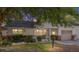 Charming single-story home at dusk featuring a well-kept lawn and an attached garage at 9855 Sw 85Th Terrace Rd # A, Ocala, FL 34481