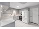 Well-lit kitchen featuring gray cabinets and modern appliances at 9855 Sw 85Th Terrace Rd # A, Ocala, FL 34481