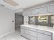 Bright kitchen features stone countertops, gray cabinets and white tile flooring at 9855 Sw 85Th Terrace Rd # A, Ocala, FL 34481