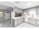 Kitchen with gray cabinets, stylish countertops, and tile floors at 9855 Sw 85Th Terrace Rd # A, Ocala, FL 34481