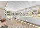 Enclosed lanai with a concrete floor and white frame at 9855 Sw 85Th Terrace Rd # A, Ocala, FL 34481