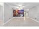 Open living room with tile floors and mural featuring the city of Venice at 9855 Sw 85Th Terrace Rd # A, Ocala, FL 34481