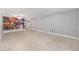 Spacious living room featuring tile flooring and an artistic wall mural at 9855 Sw 85Th Terrace Rd # A, Ocala, FL 34481