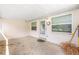 Back patio featuring covered area with concrete floor and a door to enter the property at 9855 Sw 85Th Terrace Rd # A, Ocala, FL 34481