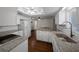 A modern kitchen showcasing granite countertops and stainless steel sink with a gooseneck faucet at 10668 Sw 85Th Ter, Ocala, FL 34481