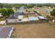 Aerial view of the home featuring fenced backyard and multiple sheds at 1114 Hickory Rd, Ocala, FL 34472