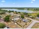 Aerial view of property highlighting the lake and neighborhood at 1114 Hickory Rd, Ocala, FL 34472