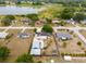 Lovely aerial view of the property, showcasing a tranquil lake and charming neighborhood at 1114 Hickory Rd, Ocala, FL 34472