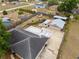 Aerial view of the home with a fenced backyard and garage at 1114 Hickory Rd, Ocala, FL 34472