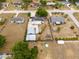Aerial view of the property showcasing the backyard, sheds and location within the community at 1114 Hickory Rd, Ocala, FL 34472