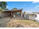 Spacious backyard featuring a storage shed and covered area, offering ample space at 1114 Hickory Rd, Ocala, FL 34472