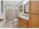 Traditional bathroom features a vanity with cabinets and a shower with a curtain at 1114 Hickory Rd, Ocala, FL 34472