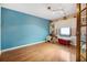 Bright bedroom with hardwood floors, natural light, and built-in shelving at 1114 Hickory Rd, Ocala, FL 34472