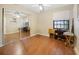 Neutral bedroom featuring mirrored closet doors and laminate wood flooring at 1114 Hickory Rd, Ocala, FL 34472