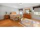 Bright bedroom features hardwood floors, a large dresser, and an ornate area rug at 1114 Hickory Rd, Ocala, FL 34472