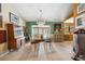 Cozy dining area with a chandelier and views into the kitchen and living room at 1114 Hickory Rd, Ocala, FL 34472