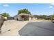 View of the exterior with a spacious concrete pad and covered seating area at 1114 Hickory Rd, Ocala, FL 34472