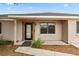 Close-up of the front door and front-yard landscaping at 1114 Hickory Rd, Ocala, FL 34472