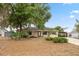 Charming single-story home with mature landscaping and a welcoming front entrance at 1114 Hickory Rd, Ocala, FL 34472