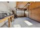 Spacious garage with a concrete floor, work benches and plywood walls at 1114 Hickory Rd, Ocala, FL 34472