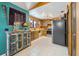 Unique kitchen with teal accent wall, colorful cabinet and stainless steel appliances at 1114 Hickory Rd, Ocala, FL 34472