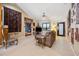 Spacious living room with unique decor and a view into the dining area at 1114 Hickory Rd, Ocala, FL 34472