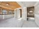 Unfinished room features concrete floors, plywood ceiling, and natural light at 1114 Hickory Rd, Ocala, FL 34472