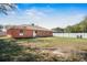 Expansive backyard featuring a well-maintained lawn and a privacy fence perfect for outdoor activities at 13425 Sw 106Th Pl, Dunnellon, FL 34432