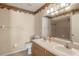Bathroom features tiled floors, wallpaper, double sinks and shower and tub combo for relaxation at 13425 Sw 106Th Pl, Dunnellon, FL 34432