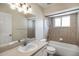 A bathroom with double sinks, a shower and tub combo and tiled walls for easy cleaning at 13425 Sw 106Th Pl, Dunnellon, FL 34432