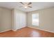 Bedroom featuring ceiling fan, closet and wood floor at 13425 Sw 106Th Pl, Dunnellon, FL 34432