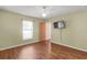 Bedroom featuring laminate floors, neutral walls, a ceiling fan and a window for natural light at 13425 Sw 106Th Pl, Dunnellon, FL 34432
