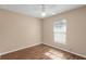 Bedroom features neutral walls, a ceiling fan, and laminate flooring at 13425 Sw 106Th Pl, Dunnellon, FL 34432