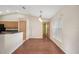 Dining room featuring wood floors, neutral walls, and adjacent kitchen at 13425 Sw 106Th Pl, Dunnellon, FL 34432