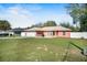 Charming single-story home with a two-car garage, well-manicured lawn, and a welcoming front yard at 13425 Sw 106Th Pl, Dunnellon, FL 34432