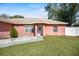 Inviting single-story house with landscaped front yard, white rock features, and a charming front door at 13425 Sw 106Th Pl, Dunnellon, FL 34432