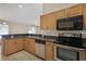 Kitchen with stainless steel appliances and granite countertop at 13425 Sw 106Th Pl, Dunnellon, FL 34432