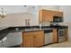 Kitchen featuring stainless steel appliances, granite countertops and oak cabinets at 13425 Sw 106Th Pl, Dunnellon, FL 34432