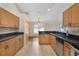 Kitchen features ample counterspace, wood cabinets and stainless steel sink at 13425 Sw 106Th Pl, Dunnellon, FL 34432