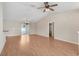 Bright living room with hardwood floors and patio access, seamlessly connecting to the open-concept kitchen at 13425 Sw 106Th Pl, Dunnellon, FL 34432