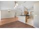 Open-concept living area flows into kitchen with modern fixtures and dining space, enhancing entertaining at 13425 Sw 106Th Pl, Dunnellon, FL 34432