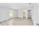 Bright bedroom with sleek floors, a large window, and neutral decor at 13505 Sw 112 Pl, Dunnellon, FL 34432