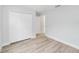 Bedroom with a large closet and wood-look flooring, providing ample storage space at 13505 Sw 112 Pl, Dunnellon, FL 34432