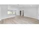 Bright and spacious living area with an open floor plan and access to other rooms at 13505 Sw 112 Pl, Dunnellon, FL 34432